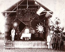 Sun Yat-sen (middle) and Chiang Kai-shek (on stage in uniform) at the founding of the Whampoa Military Academy in 1924.