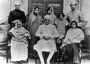 The Nehru family - Motilal Nehru is seated in the center, and standing (L to R) are Jawaharlal Nehru, Vijayalakshmi Pandit, Krishna Hutheesing, Indira, and  Ranjit Pandit; Seated: Swaroop Rani, Motilal Nehru and Kamala Nehru (circa 1927).