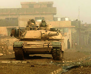 Soldiers from U.S. 3d Armored Cavalry Regiment provide overwatch for troops from their M1 Abrams tank in Biaj, Iraq