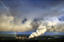 Rainbow and volcanic ash with sulfur dioxide emissions from Halema`uma`u vent.