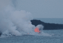 Lava explodes as it hits ocean waves