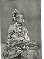A young Tamil girl wearing rich gold ornaments. Source:The National Geographic Magazine, April 1907