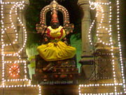 An idol in Madurai representing the Tamil language as a goddess; The caption on the pedestal reads Tamil Annai ("Mother Tamil").