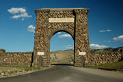 The Roosevelt Arch is located in Montana at the North Entrance. The arch's cornerstone was laid by Theodore Roosevelt. The placard reads  "For the Benefit and Enjoyment of the People." 