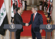 President Bush shakes hands with Iraqi Prime Minister Nouri al-Maliki.