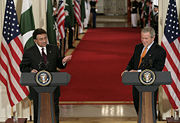 President Pervez Musharraf of Pakistan and United States President George W. Bush respond to reporters during a joint press conference in the East Room of the White House in late 2006.