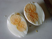 A hardboiled double-yolked egg, cut in half