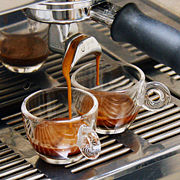 Espresso brewing, with dark reddish-brown crema