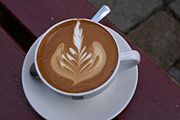 Presentation is an integral part of coffeehouse service, as illustrated by the fancy design layered into this latte