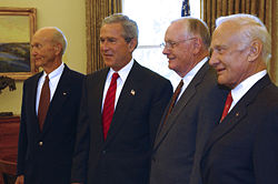 Michael Collins, President George W. Bush, Armstrong, and Aldrin in the White House Oval Office during celebrations of the 35th anniversary of the Apollo 11 flight, July 21, 2004