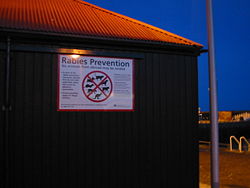 Sign at a UK port showing rabies prevention measures aimed at merchant seamen