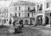 A scene during World War II on the streets of Kuala Lumpur. The scene depicts Japanese troops clearing up the streets.