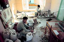 Cutting and grinding turquoise in Meshed, Iran. 1973.