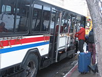 A Utah Transit Authority bus with ski racks.