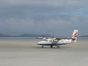 A Loganair Twin Otter at Barra Airport, the world's only airport using a beach runway for scheduled services.