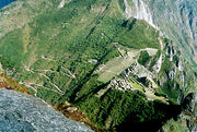 View of Machu Picchu from Huayna Picchu, showing the Hiram Bingham Highway used by buses carrying tourists to and from the town of Aguas Calientes.