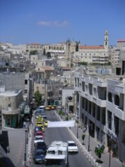 A street in Bethlehem lined with taxis