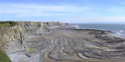 Wave cut platform caused by erosion of cliffs by the sea, at Southerndown in South Wales