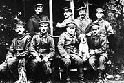 A young Hitler (left) posed with other German soldiers