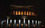 The Opera House illuminated at night.
