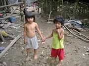 Siblings living in extreme poverty near a dump in El Salvador with no access to safe drinking water.