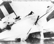 Rescuers scramble across the wreckage of British R-38/USN ZR-2, August 24, 1921