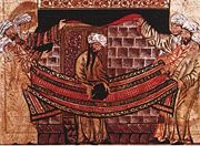 A 1315 image of Muhammad lifting the Black Stone into place, when the Kaaba was rebuilt in the early 600s.