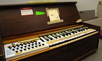 An electrically blown reed chord organ.