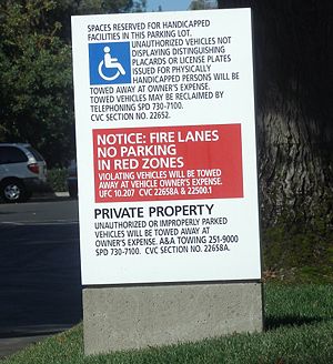This sign declaring a parking lot to be "private property" illustrates one method of identifying and protecting property.  Note the citations to legal statutes.