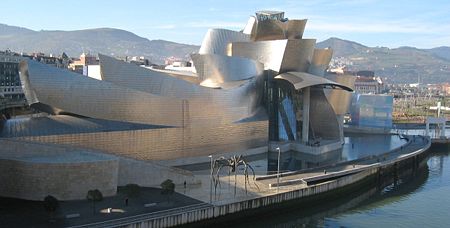 The Guggenheim Museum Bilbao by Frank Gehry, on the Nervión River in downtown Bilbao, Spain.
