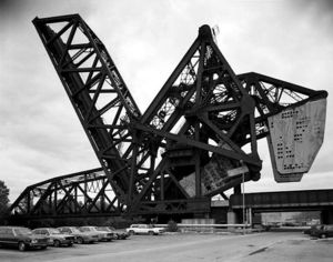The B&OCT Bascule Bridge over the Chicago River, as seen from the northwest, circa 1988.  This view shows the abandoned bridge in its locked upright position, with that of the St. Charles Air Line Railroad in the background.