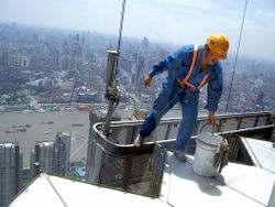 A window washer on one of the thousands of skyscrapers in Shanghai.