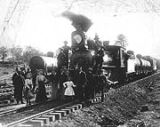 A group photo of passengers who rode on the first run of the Grand Canyon Railway.