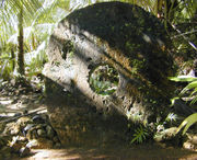 A large (approximately 8 feet (2.4 m) in height) example of Yapese stone money in the village of Gachpar.