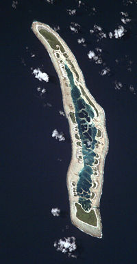 NASA orbital photo of Caroline Island; north is to the upper right. The two largest islets are Nake Islet (top) and South Islet (bottom) and are about 500 m wide.