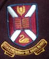 The school badge on a blazer worn by students from Years 8 to 11
