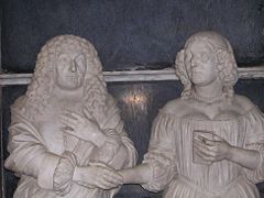 The tomb of Sir John Brownlow I and his wife Alice Pulteney. "...marble hands clasped everlastingly in mutual consolation for their childless marriage".