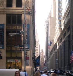 Wall Street, Manhattan is the location of the New York Stock Exchange and is often used as a symbol for the world of business.[citation needed]