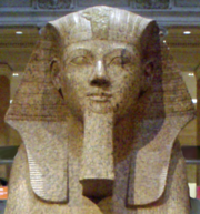 Large granite sphinx bearing the likeness of the pharaoh Hatshepsut, depicted with the traditional false beard, a symbol of her pharaonic power, residing in the Metropolitan Museum of Art