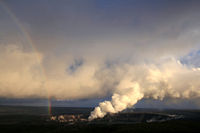 Rainbow and volcanic ash with sulfur dioxide emissions from Halema`uma`u vent.