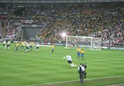 Beckham takes the free kick against Brazil that John Terry scored from.