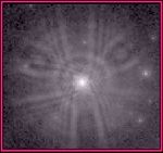 An extract from a WF/PC image shows the light from a star spread over a wide area instead of being concentrated on a few pixels.