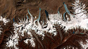 This image shows the termini of the glaciers in the Bhutan Himalaya. Glacial lakes have been rapidly forming on the surface of the debris-covered glaciers in this region during the last few decades.