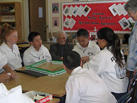 Students in the United States learning how to play Mahjong