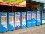 Drinking water vending machines in Thailand. One liter of purified water is sold (into the customer's own bottle) for 1 baht