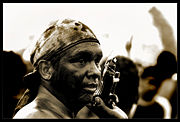 During the Santo Domingo festival some people cover themselves in a mix of grease and motor oil to pay promises to the saint while others wear masks and costumes.