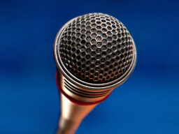 a microphone against a blue background