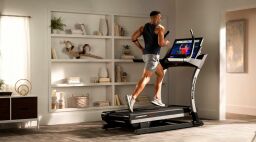 a man running on the NordicTrack Commercial X32i treadmill