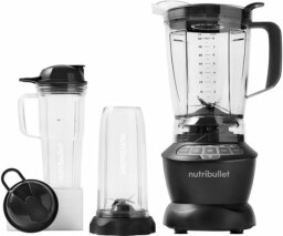 Nutribullet blender sitting next to cups and attachments