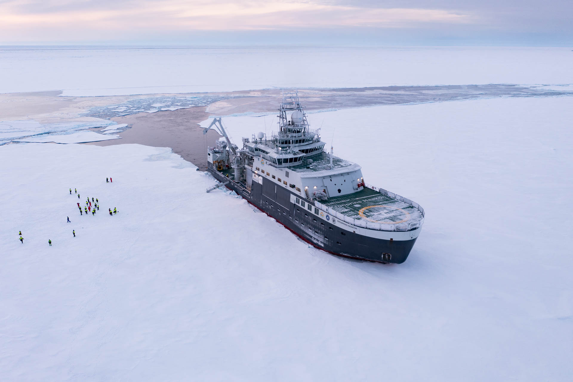 Researchers standing on an Arctic ice floe during the HACON mission.